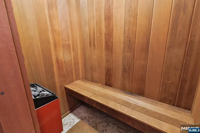 a view of a room with a wooden door and a curtain