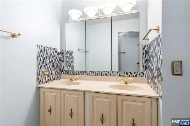 a bathroom with a sink and a mirror