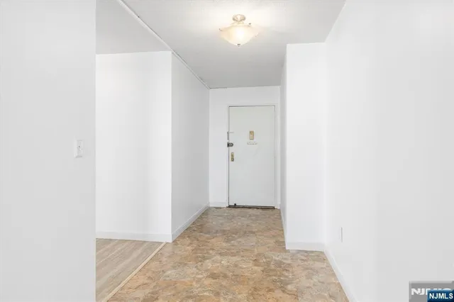 a view of a room with a hallway