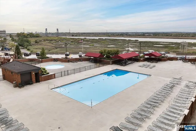 a view of a swimming pool with an ocean view