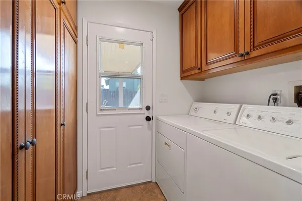 a view of storage and utility room with washer and dryer