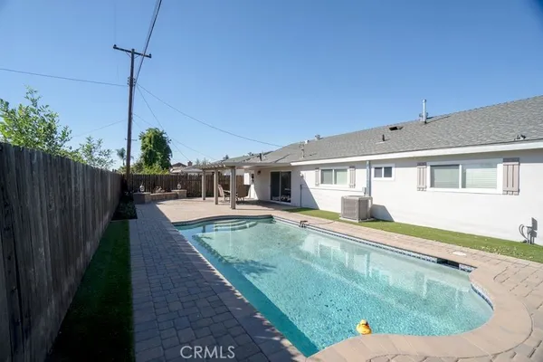 a view of a house with swimming pool