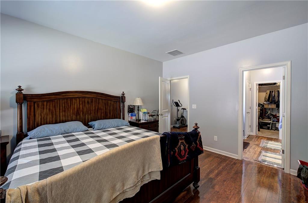 40 Ponders Road Cartersville, GA 30121 - Photo 14 of 30 a bedroom with a bed and wooden floor