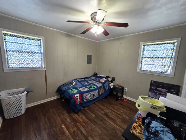 a bedroom with bed and a window