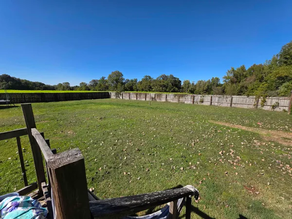 a view of a back yard from a lake view