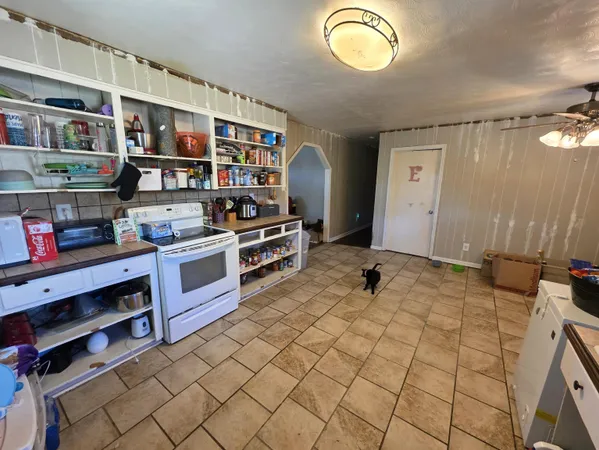 a room with lots of furniture and a window