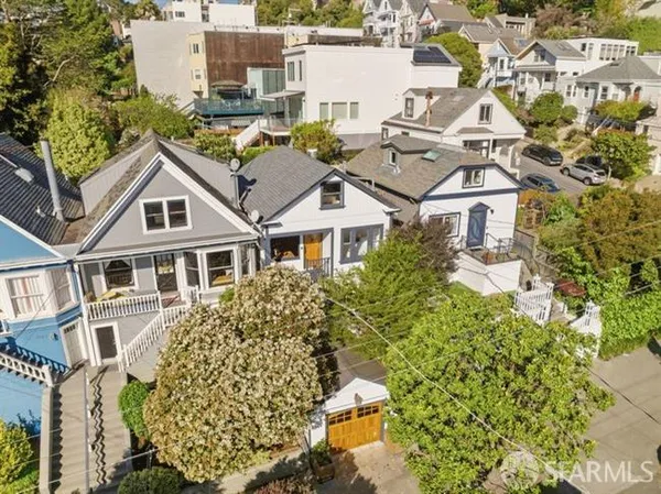 an aerial view of a residential apartment building with a yard