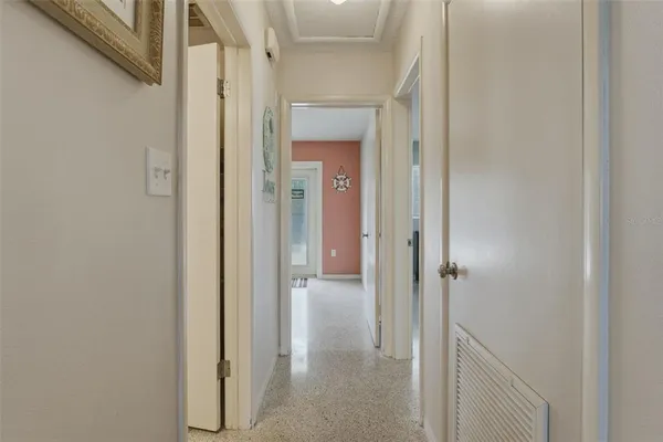 a view of a bathroom from a hallway