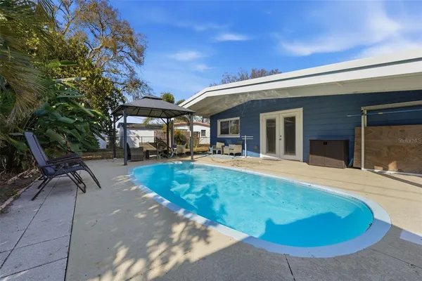 a view of outdoor space yard swimming pool and porch