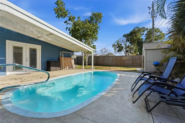 a view of a house with swimming pool
