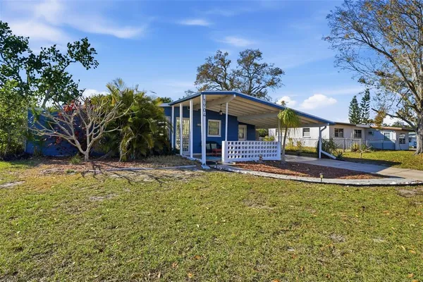 a view of a house with swimming pool yard and porch