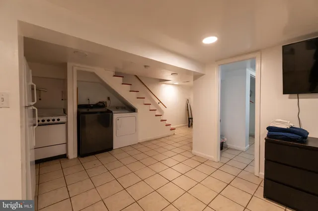 a view of a refrigerator and a stove in a room