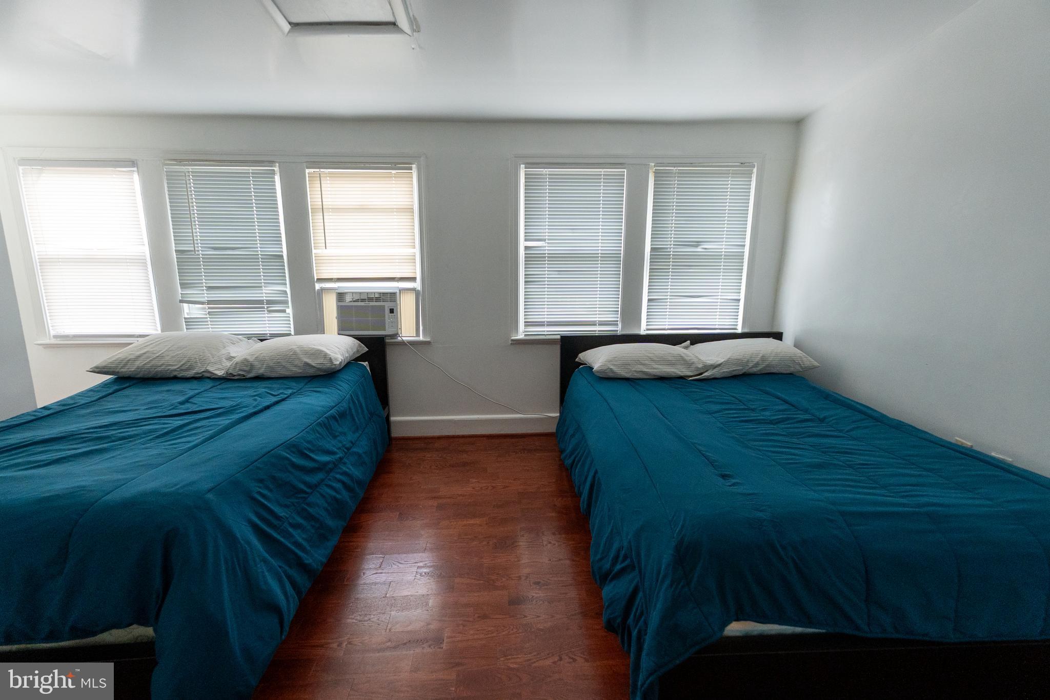 4705 8th Street Northwest Washington, DC 20011 - Photo 21 of 30 a bedroom with a bed and window