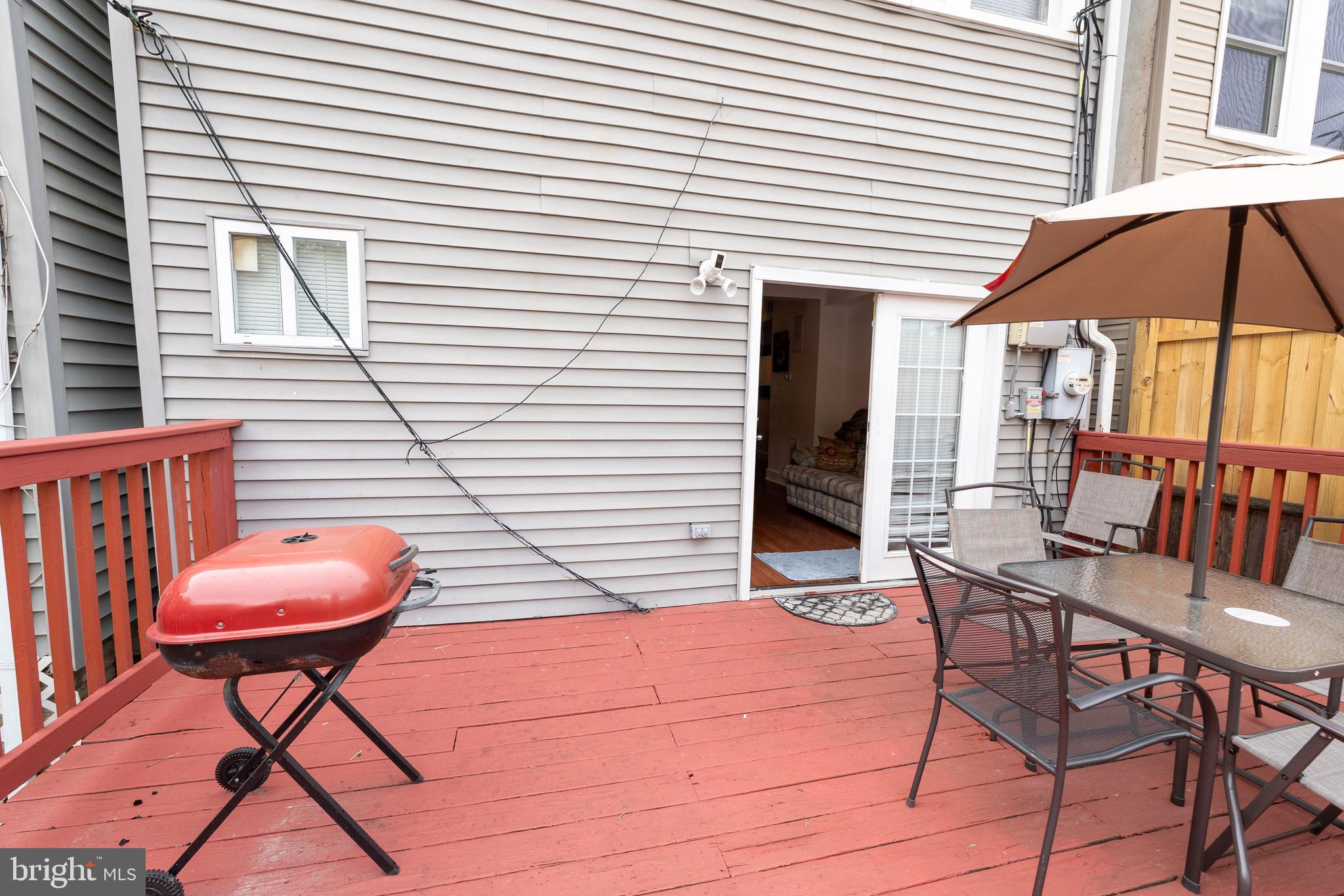 4705 8th Street Northwest Washington, DC 20011 - Photo 24 of 30 a patio with table and chairs and potted plants