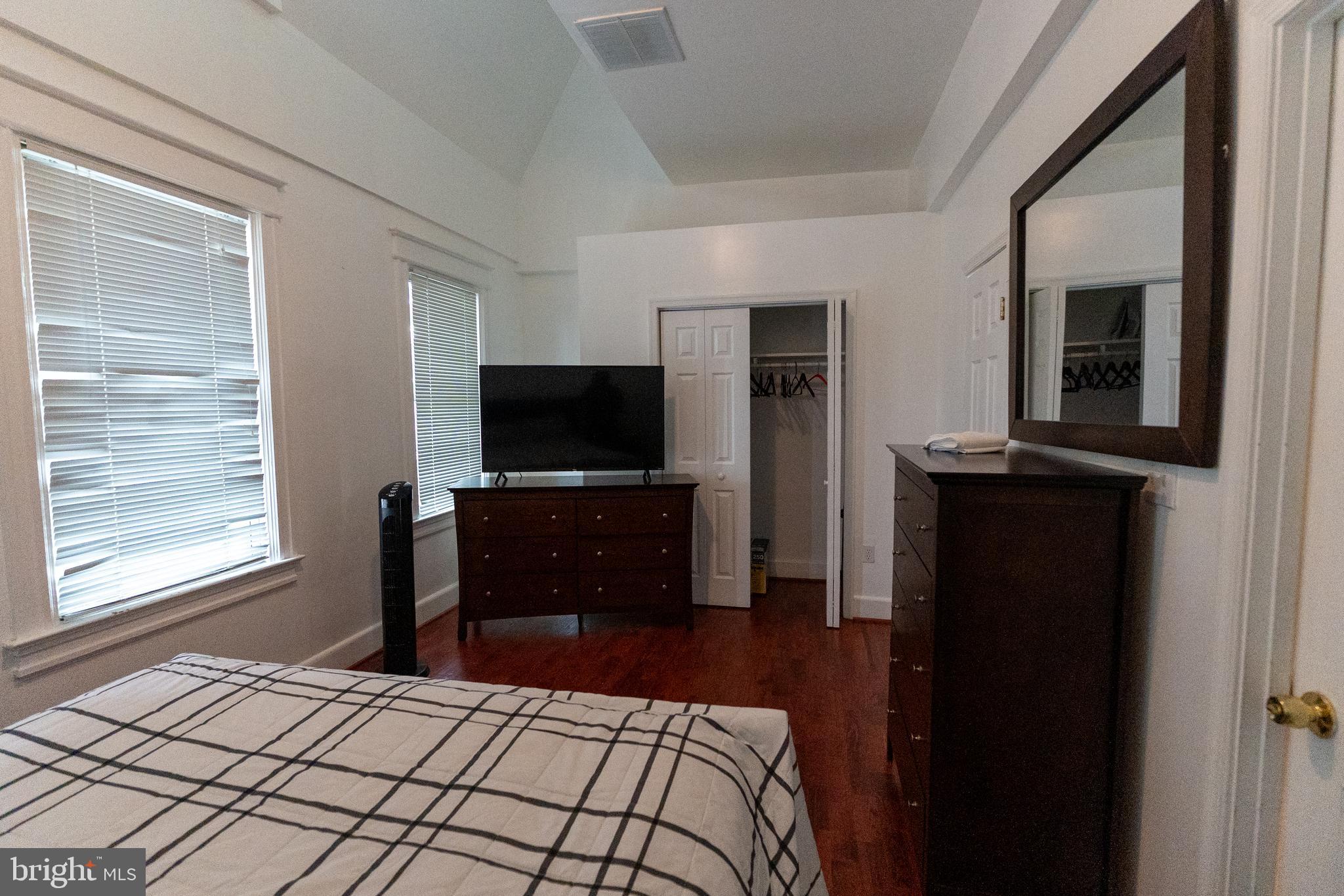 4705 8th Street Northwest Washington, DC 20011 - Photo 4 of 30 a bedroom with a bed and a flat screen tv