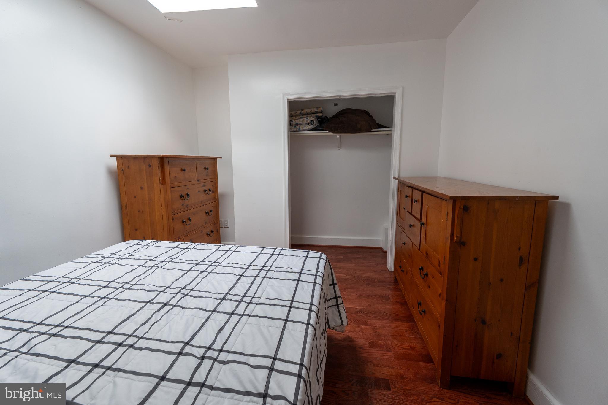 4705 8th Street Northwest Washington, DC 20011 - Photo 8 of 30 a bedroom with a bed and wooden floor