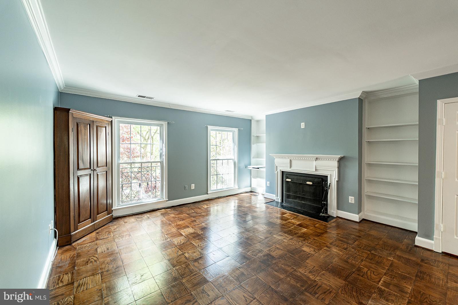 3237 Sutton Place Northwest, Unit A Washington, DC 20016 - Photo 11 of 54 Living Room view showing built-in shelving.