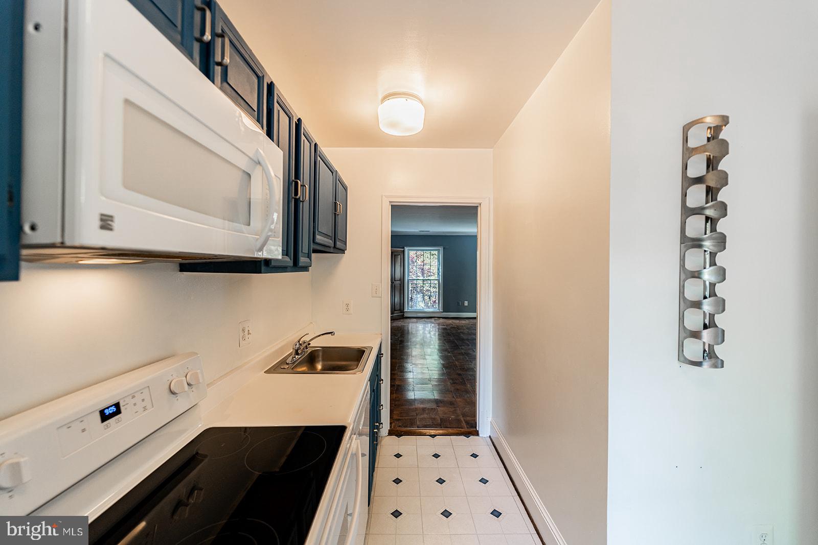 3237 Sutton Place Northwest, Unit A Washington, DC 20016 - Photo 23 of 54 Kitchen with combined Kitchen /Dining Room beyond.
