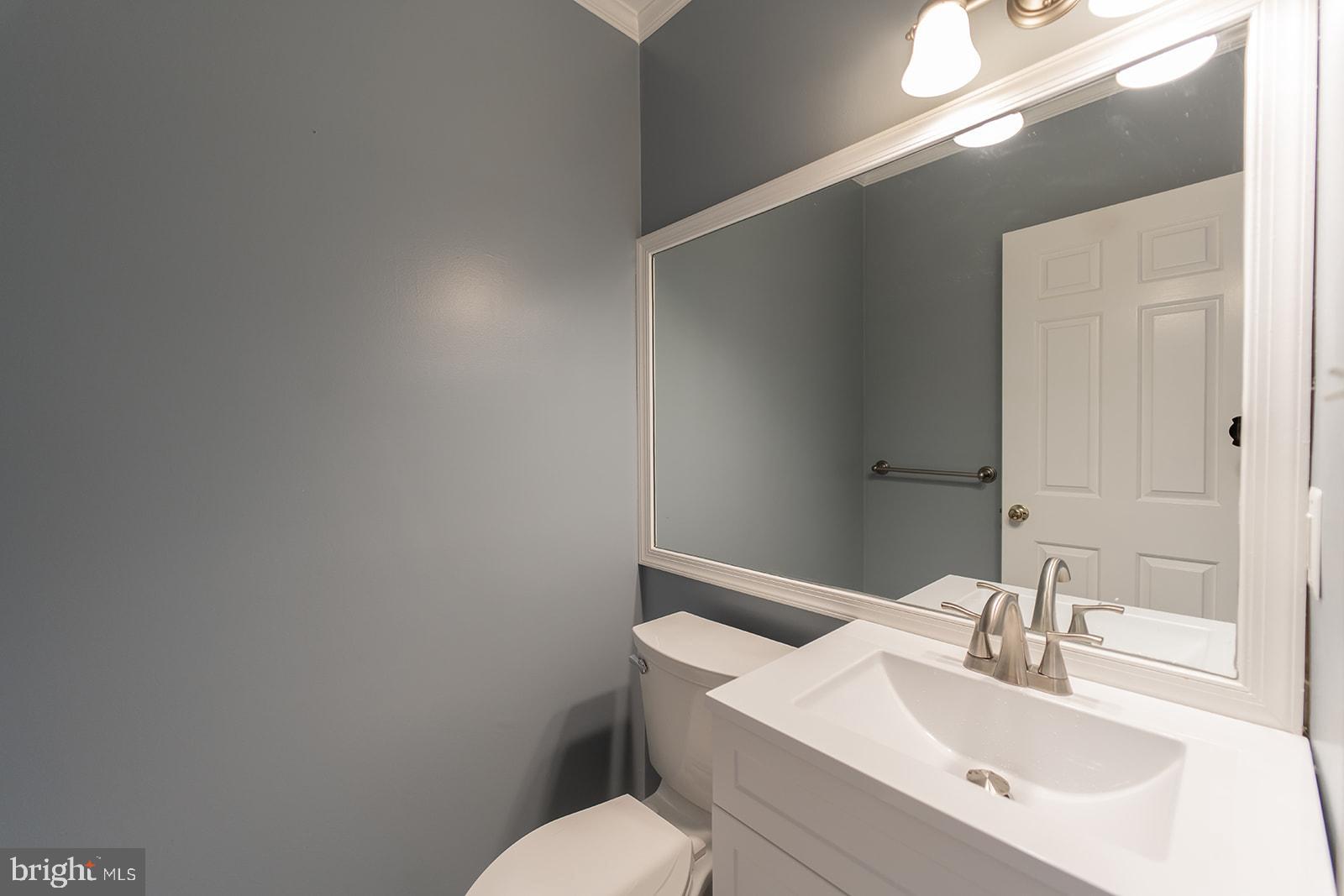 3237 Sutton Place Northwest, Unit A Washington, DC 20016 - Photo 7 of 54 Half Bathroom just off the foyer.
