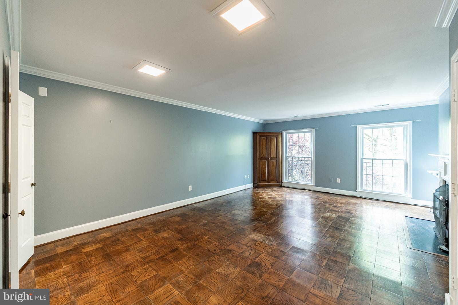 3237 Sutton Place Northwest, Unit A Washington, DC 20016 - Photo 9 of 54 Living Room w/ charming corner built-in cabinet.