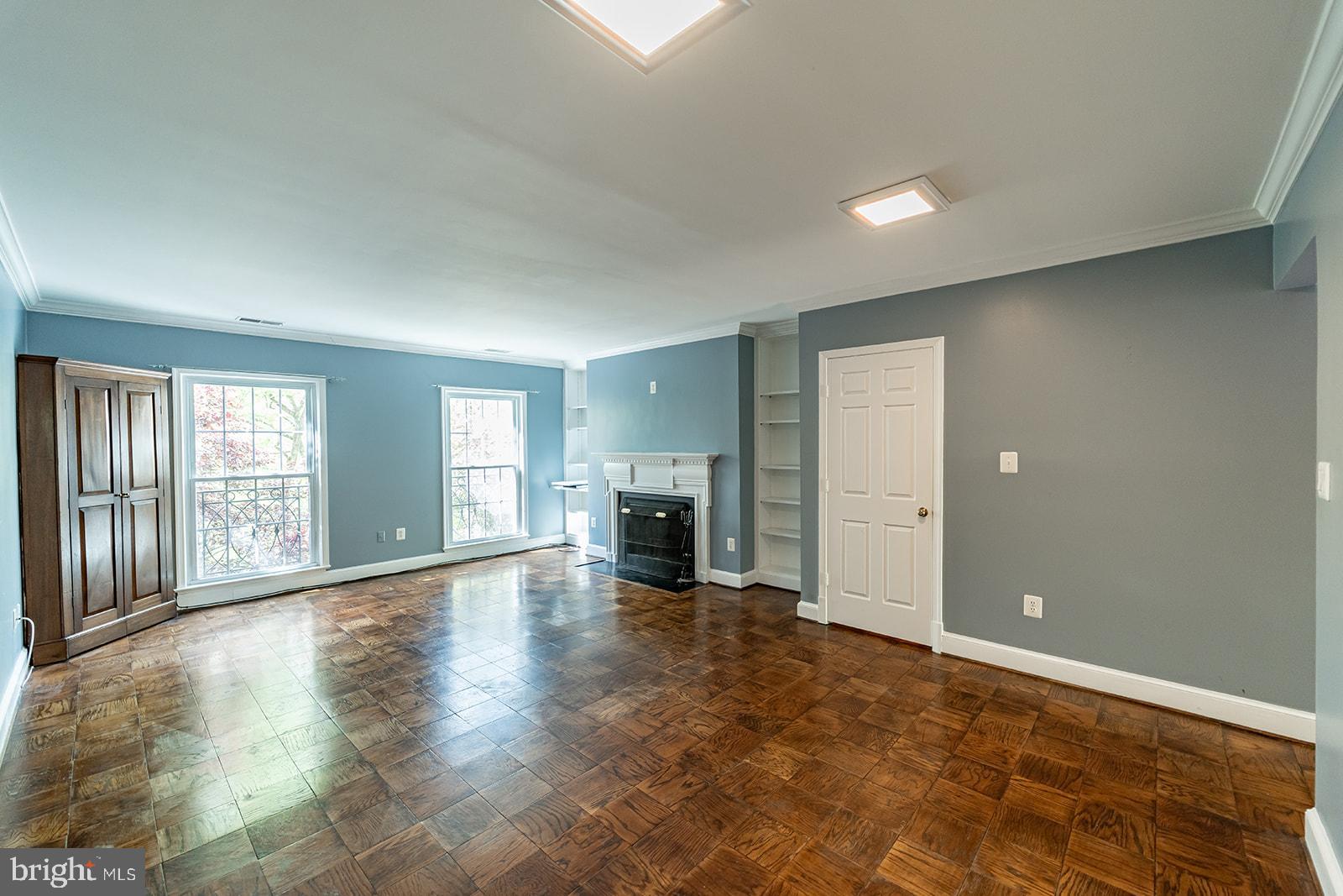 3237 Sutton Place Northwest, Unit A Washington, DC 20016 - Photo 10 of 54 Living Room with Wood Burning Fireplace.