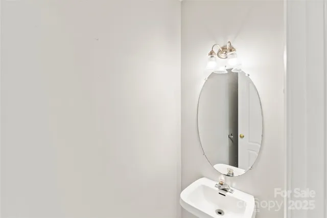 a bathroom with a sink and mirror