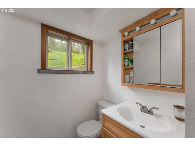 a view of walk in closet with clothes