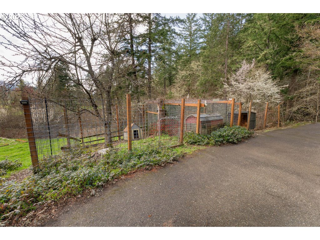 402 Northside Road Sutherlin, OR 97479 - Photo 29 of 46 a view of a garden with large trees