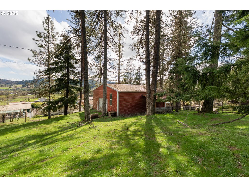 402 Northside Road Sutherlin, OR 97479 - Photo 33 of 46 a view of a yard with large trees