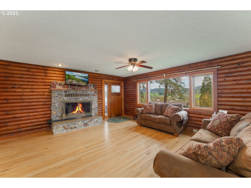 402 Northside Road Sutherlin, OR 97479 - Photo 7 of 46 a living room with furniture and a fireplace