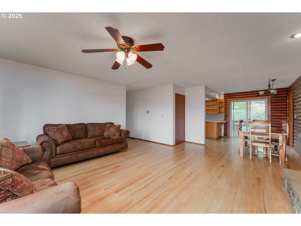 402 Northside Road Sutherlin, OR 97479 - Photo 9 of 46 a living room with furniture and a wooden floor