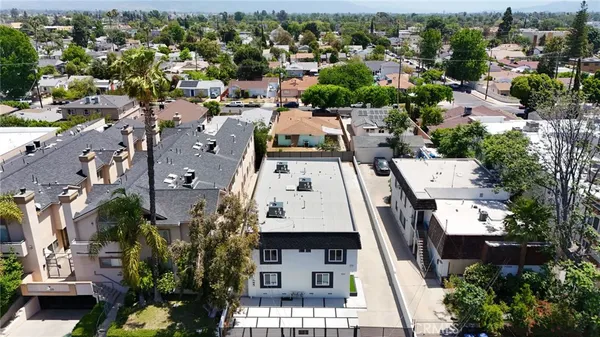 an aerial view of a multi story parking building
