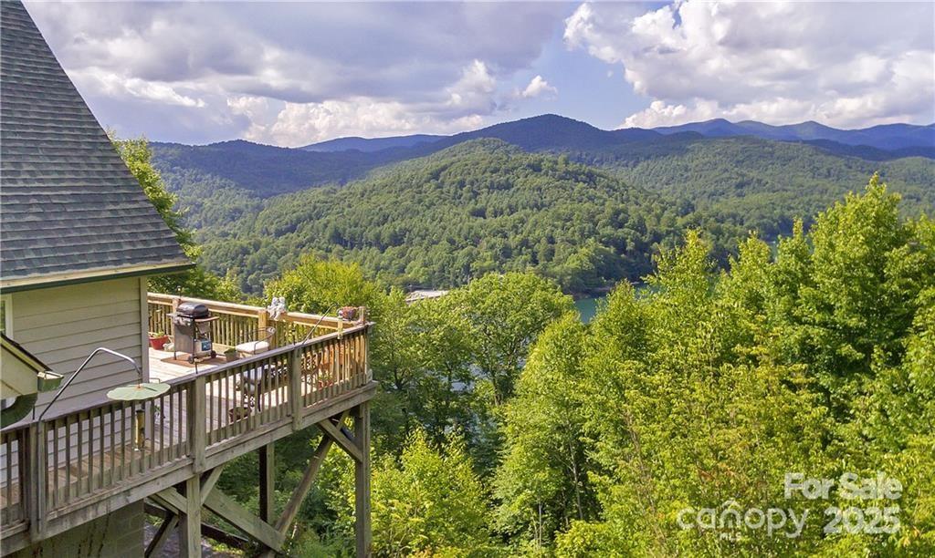 a view of a balcony with a forest