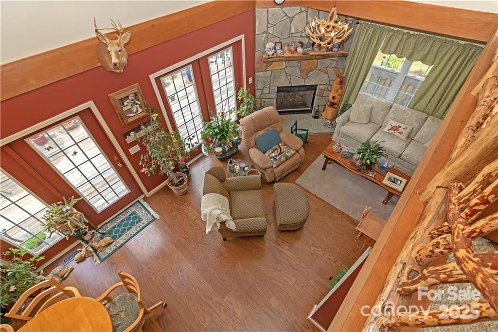 612 Old Home Place Road Tuckasegee, NC 28783 - Photo 22 of 42 a living room with furniture and a fireplace