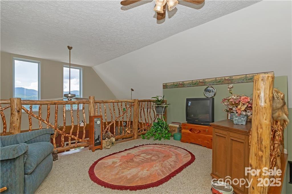 612 Old Home Place Road Tuckasegee, NC 28783 - Photo 23 of 42 a view of a livingroom with furniture and staircase