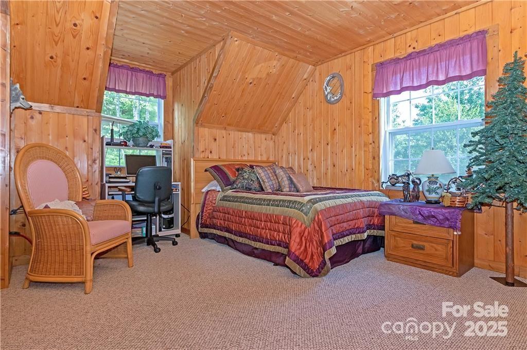 612 Old Home Place Road Tuckasegee, NC 28783 - Photo 25 of 42 a bedroom with a bed and a window