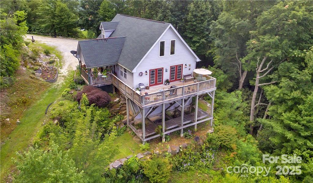 612 Old Home Place Road Tuckasegee, NC 28783 - Photo 27 of 42 an aerial view of a house with a big yard and large trees