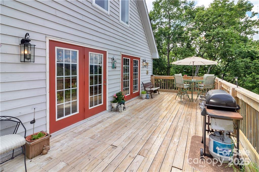 612 Old Home Place Road Tuckasegee, NC 28783 - Photo 28 of 42 a balcony with furniture and wooden floor