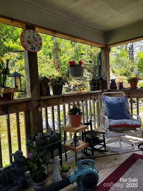 612 Old Home Place Road Tuckasegee, NC 28783 - Photo 34 of 42 a living room with furniture and floor to ceiling windows