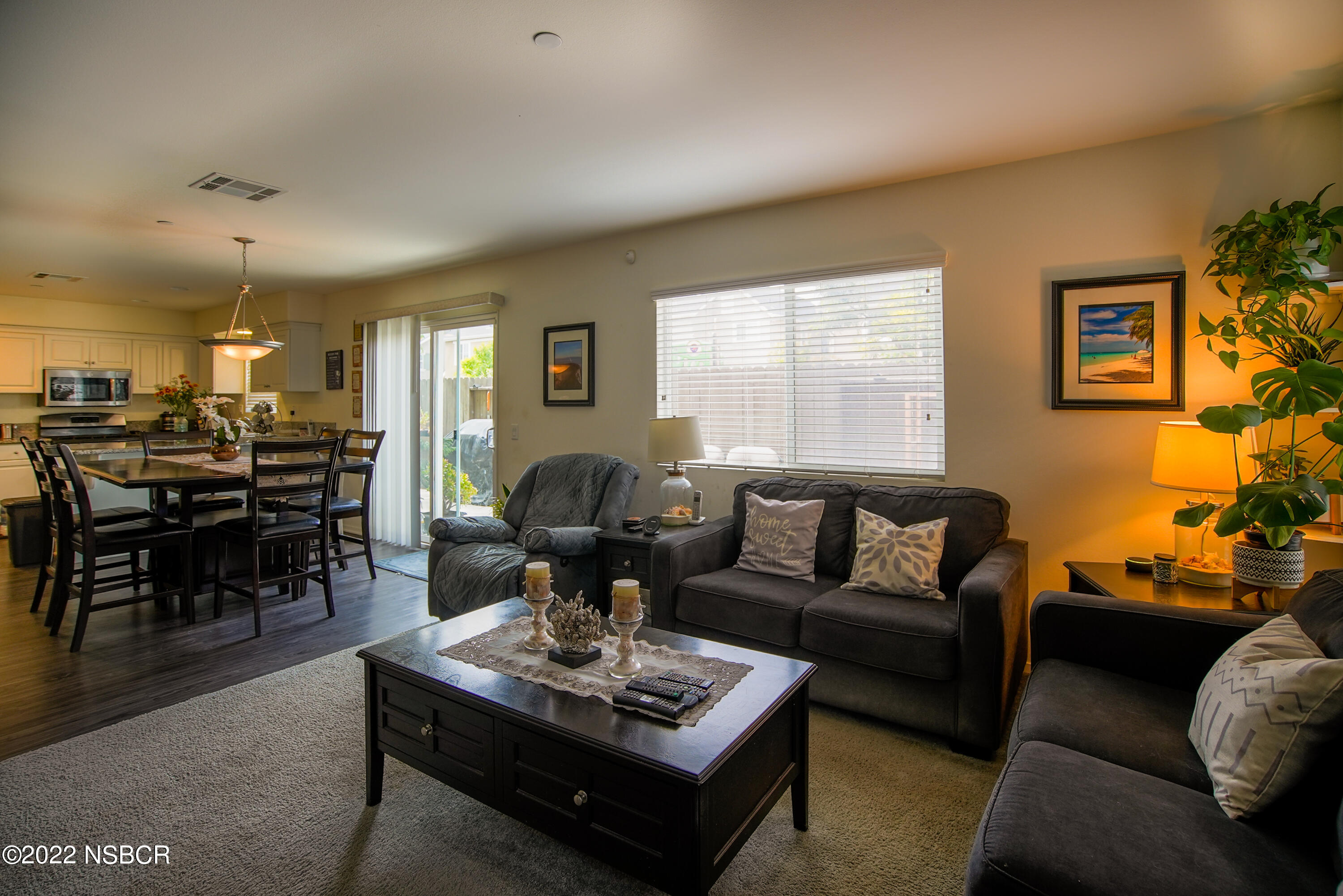 1307 Crown Circle Lompoc, CA 93436 - Photo 4 of 34 a living room with furniture couches and a dining table with wooden floor