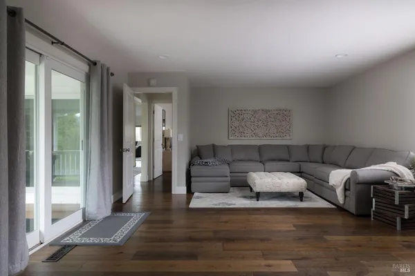 a living room with furniture and a table