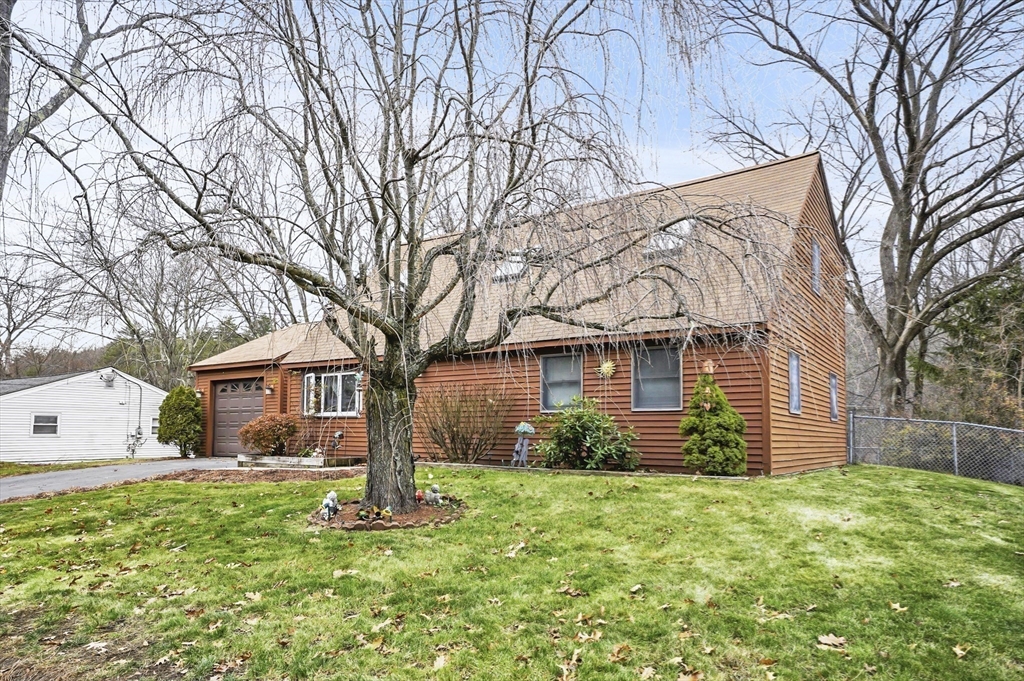 38 Candice Street Clinton, MA 01510 - Photo 12 of 13 a front view of a house with garden