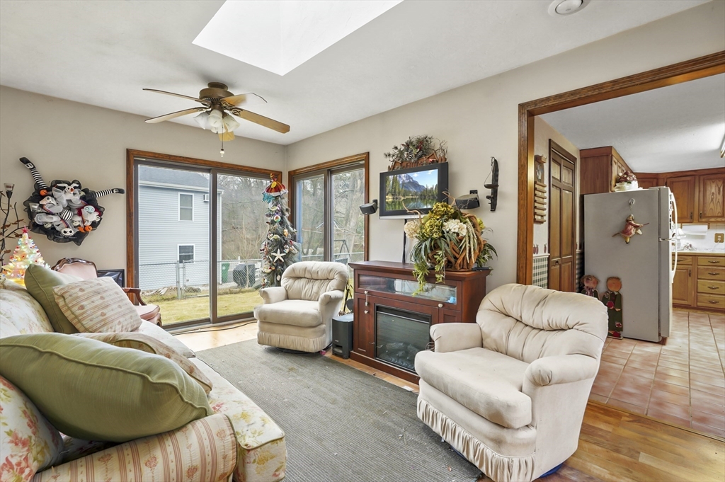 38 Candice Street Clinton, MA 01510 - Photo 5 of 13 a living room with furniture and a large window