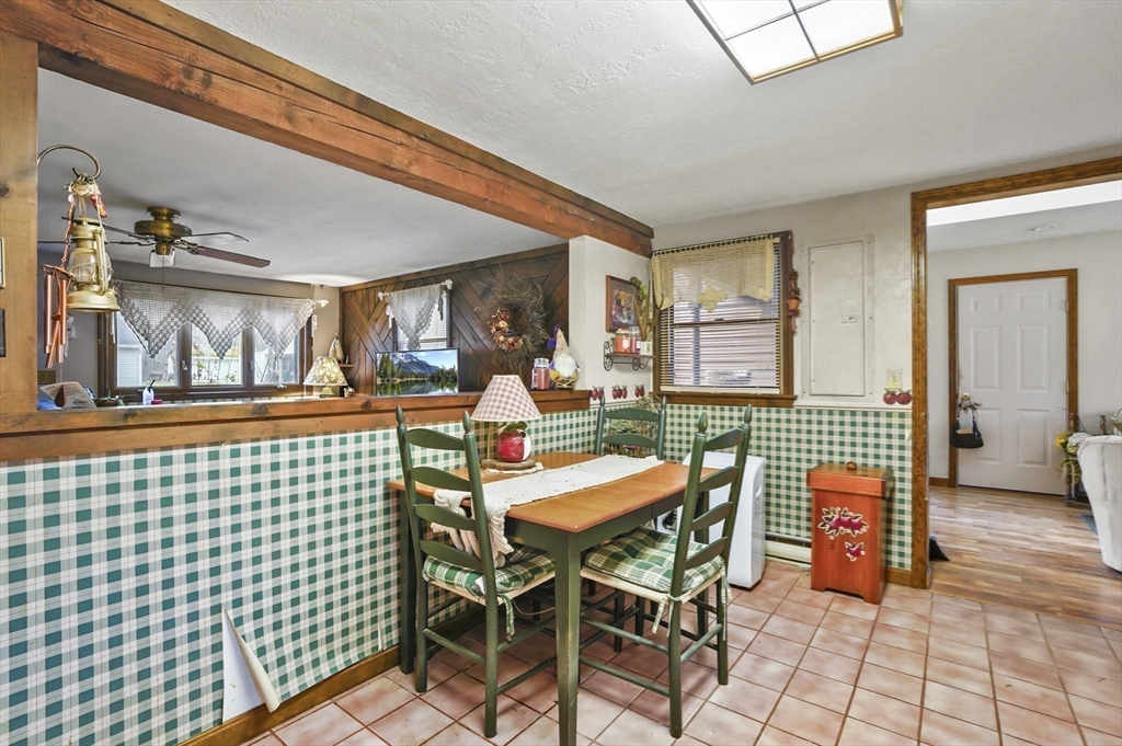 38 Candice Street Clinton, MA 01510 - Photo 6 of 13 a dining room with a table and chairs