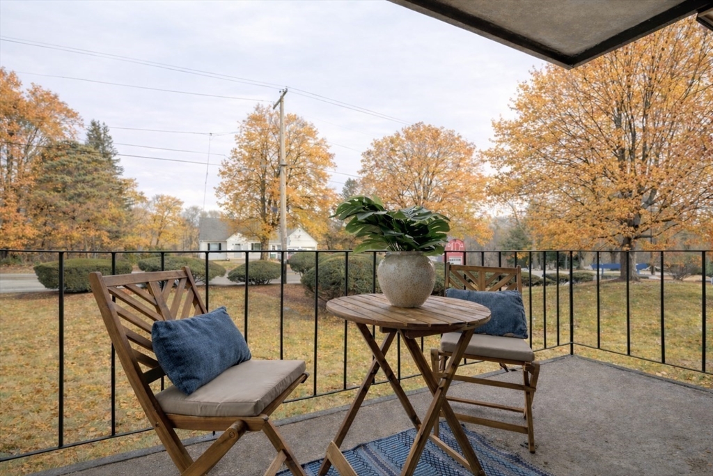 a view of a chairs and table on the deck