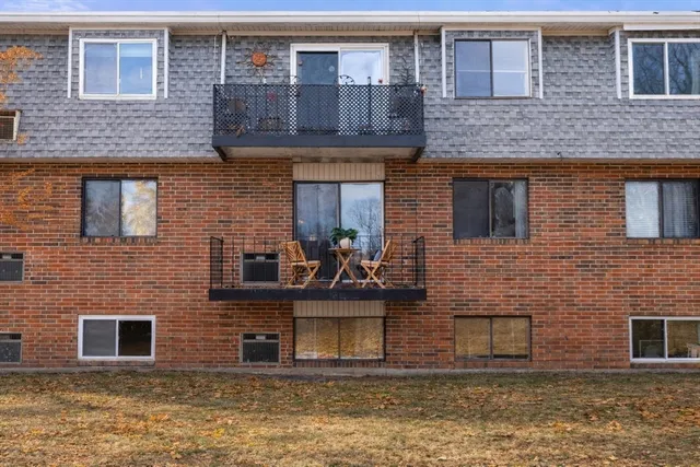 a front view of a house with large windows