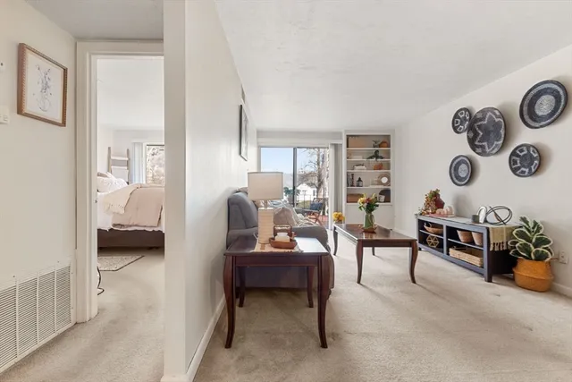 a bedroom with furniture and a lamp