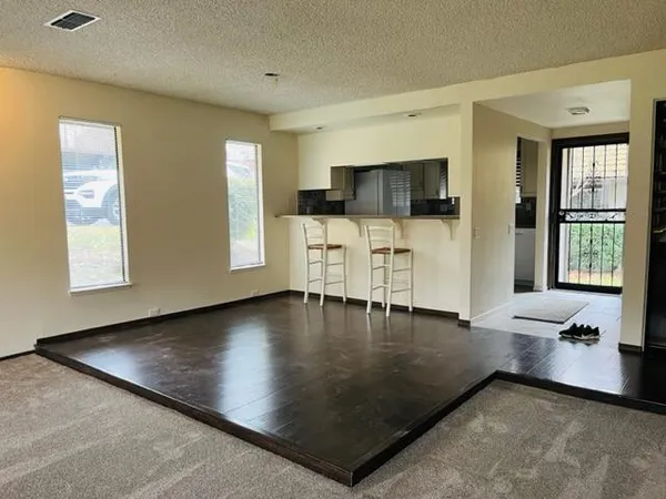 a view of livingroom with furniture window and wooden floor