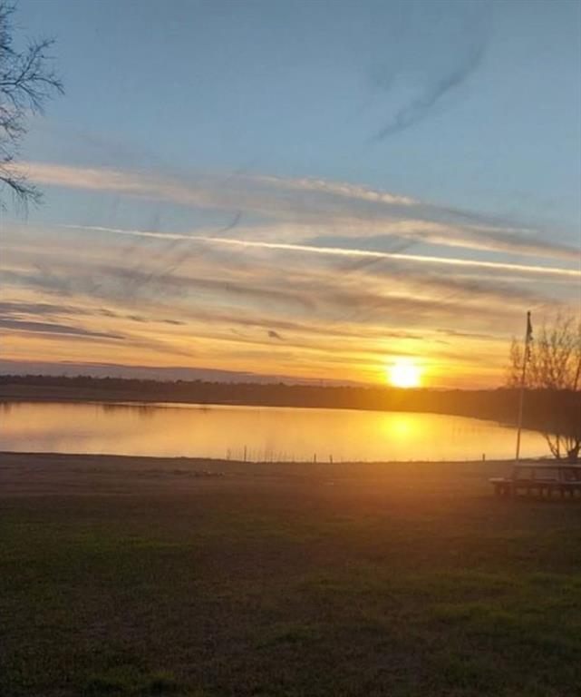 4378 Old Fort Worth Road Midlothian, TX 76065 - Photo 4 of 6 The property offers captivating lake views, enhanced by the stunning sunset