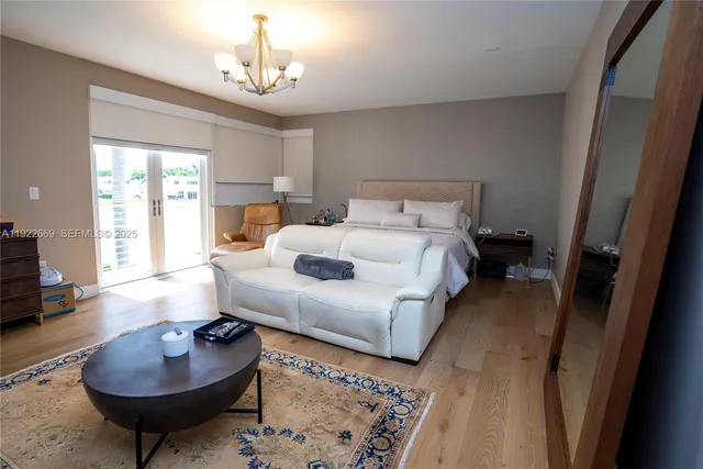 a bedroom with bed and a couch